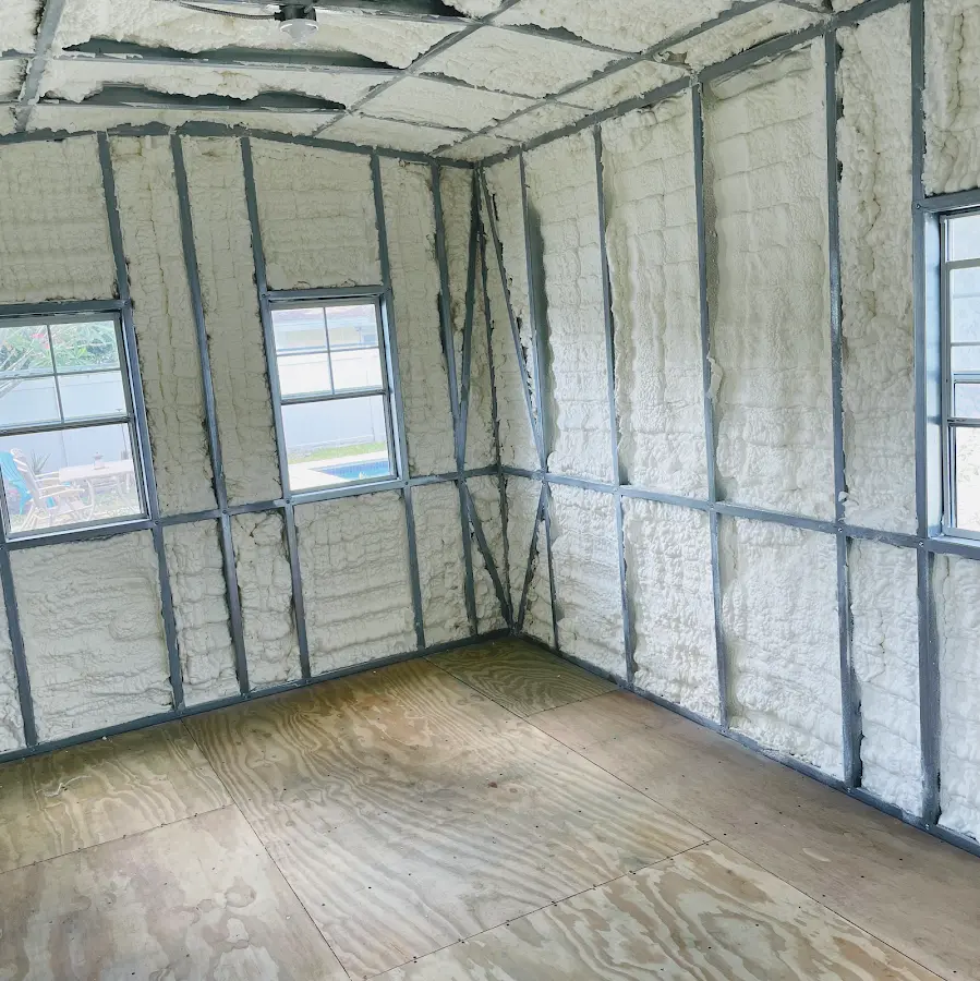 Closed-cell spray foam insulation applied to wall cavities in a residential project in Celina